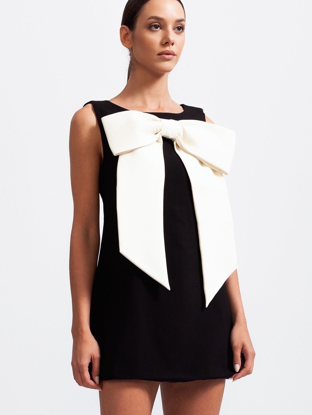 Sleeveless Black Mini Dress with Oversized Cream Bow